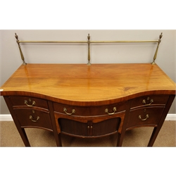 Georgian style mahogany sideboard, raised brass rail with turned columns and finials, serpentine top with ebony stringing, four drawers, centre tambour roll cupboard, tapering supports with spade feet, W153cm, H130cm (including rail), W69cm  