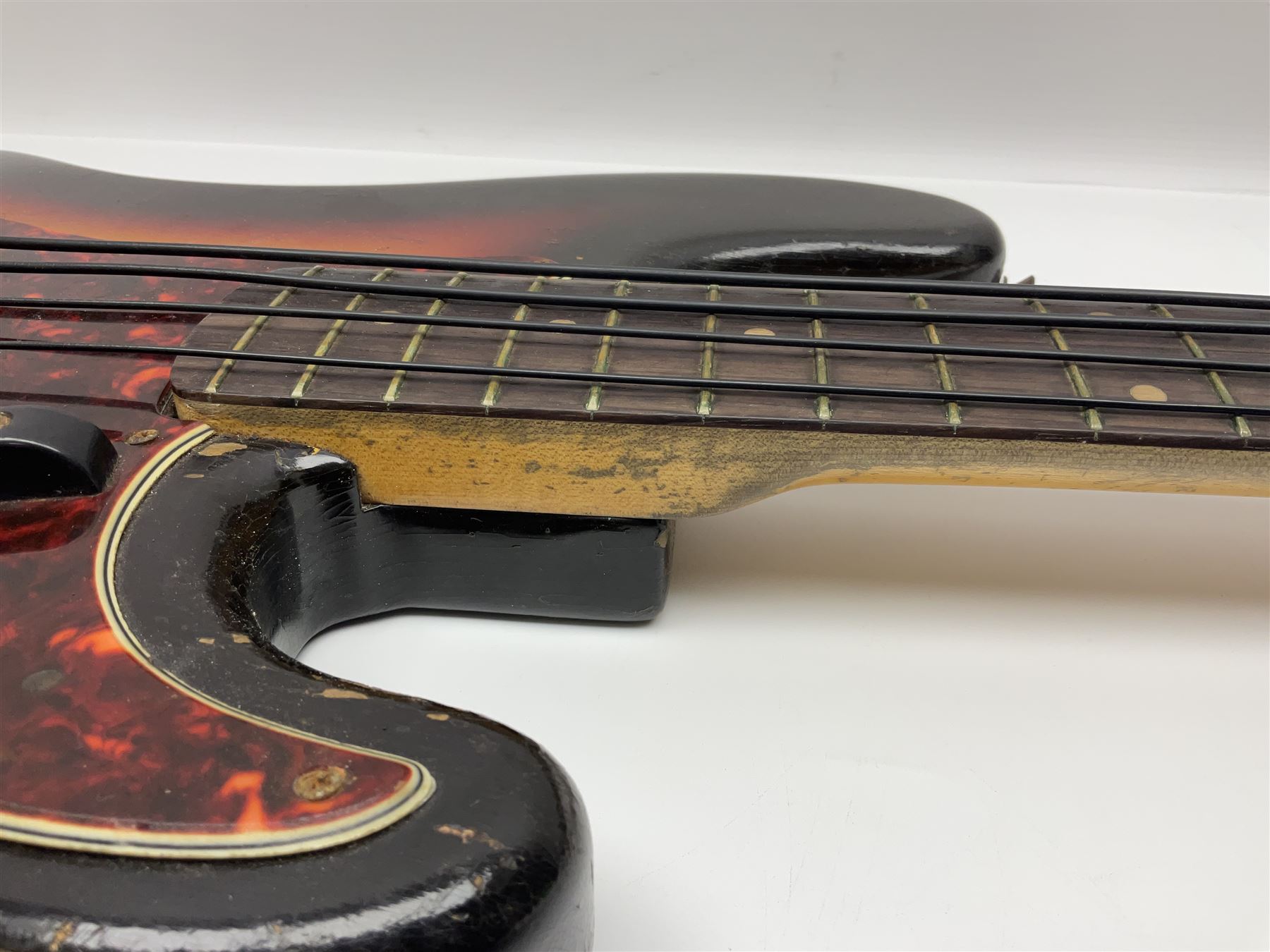 Early 1960s American Fender Precision electric bass guitar with original three-tone sunburst finish and faux tortoiseshell scratch plate; rosewood fretboard; all original fittings including chromium plated bridge and pick-up covers, finger rest, 'pots' and machines, dated on end of neck 5NOV62C, serial no.91625; L115cm overall; in Selmer simulated reptile skin covered carrying case. Sold with non-transferrable CITES A10 licence, certificate no.23GBA10CNKKEB, serial no.441200, dated 30th August 2023. Also included are original 1960s photographs of the band 'The Rascals' and photocopies of newspaper cuttings advertising their forthcoming performances along with a photocopy of a photograph of their television appearance on 'Opportunity Knocks' in 1967/8 (coming second to Mary Hopkins). In addition there is a reel-to-reel tape recording and USB stick of the band playing and two sheets of biographical information. Auctioneer's Note: The guitar was ordered by Trevor Parker from Pat Cornell's Music Shop, Spring Bank, Hull and imported from the USA in 1962, well before it was available in the UK. Trevor was the bass guitarist of The Rascals from Hull, later The Ides of March, who supported artists such as Elton John on the Hull circuit. Trevor played the guitar extensively until 1969 when The Rascals disbanded, he got married to Maureen and settled down to family life. Trevor sadly passed away in 2017, and after being in store for fifty-four years his widow has decided it is time for his guitar to be sold.