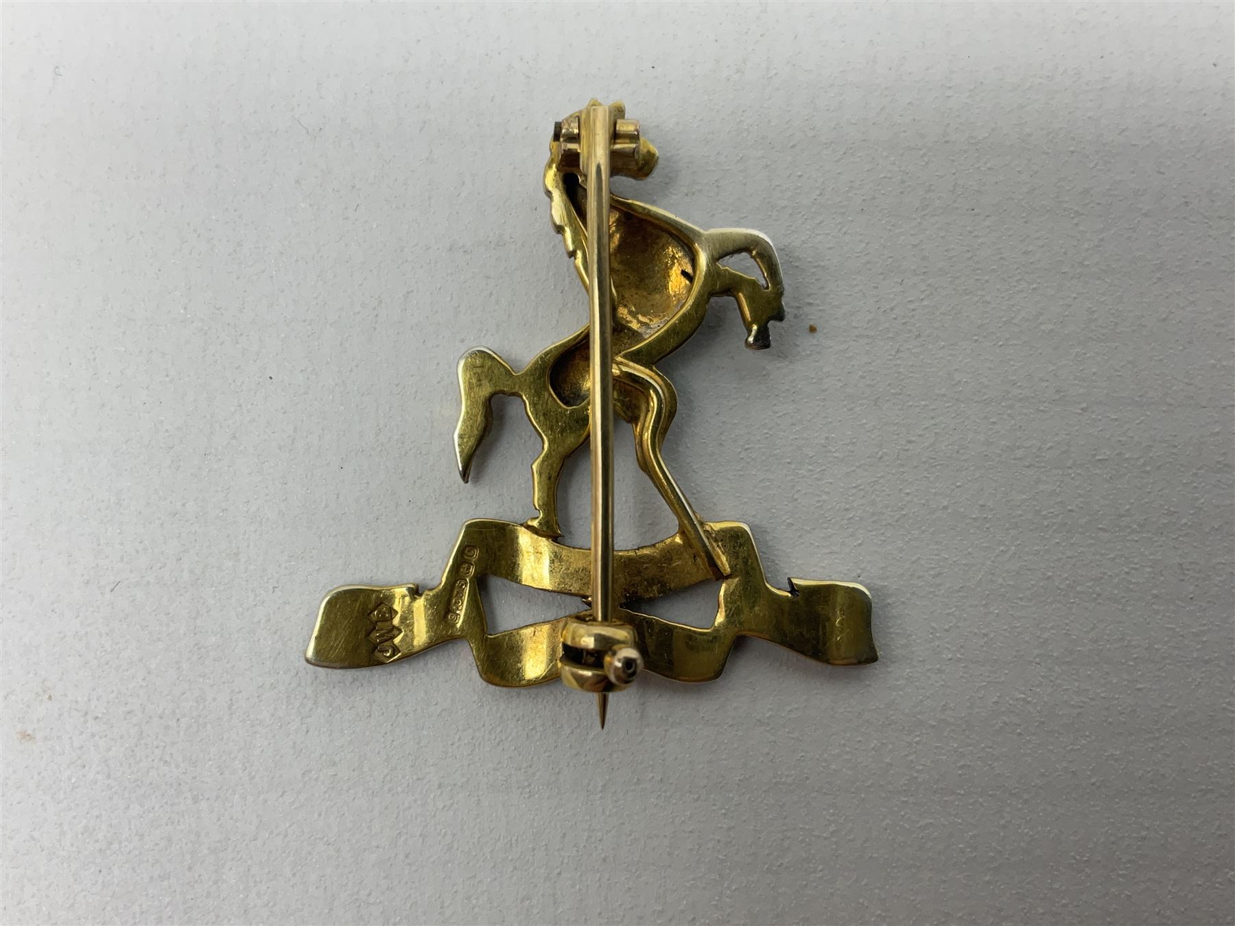 Royal West Kent regiment 9ct gold and enamel sweetheart brooch; The Queens Own regiment silver and enamel sweetheart brooch; and another sweetheart brooch for the Royal West Kent regiment (3)