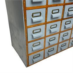 Mid-20th century multi-drawer chest or filing cabinet, fitted with thirty-five small drawers with wooden handles and metal label holders, in light blue paint finish 