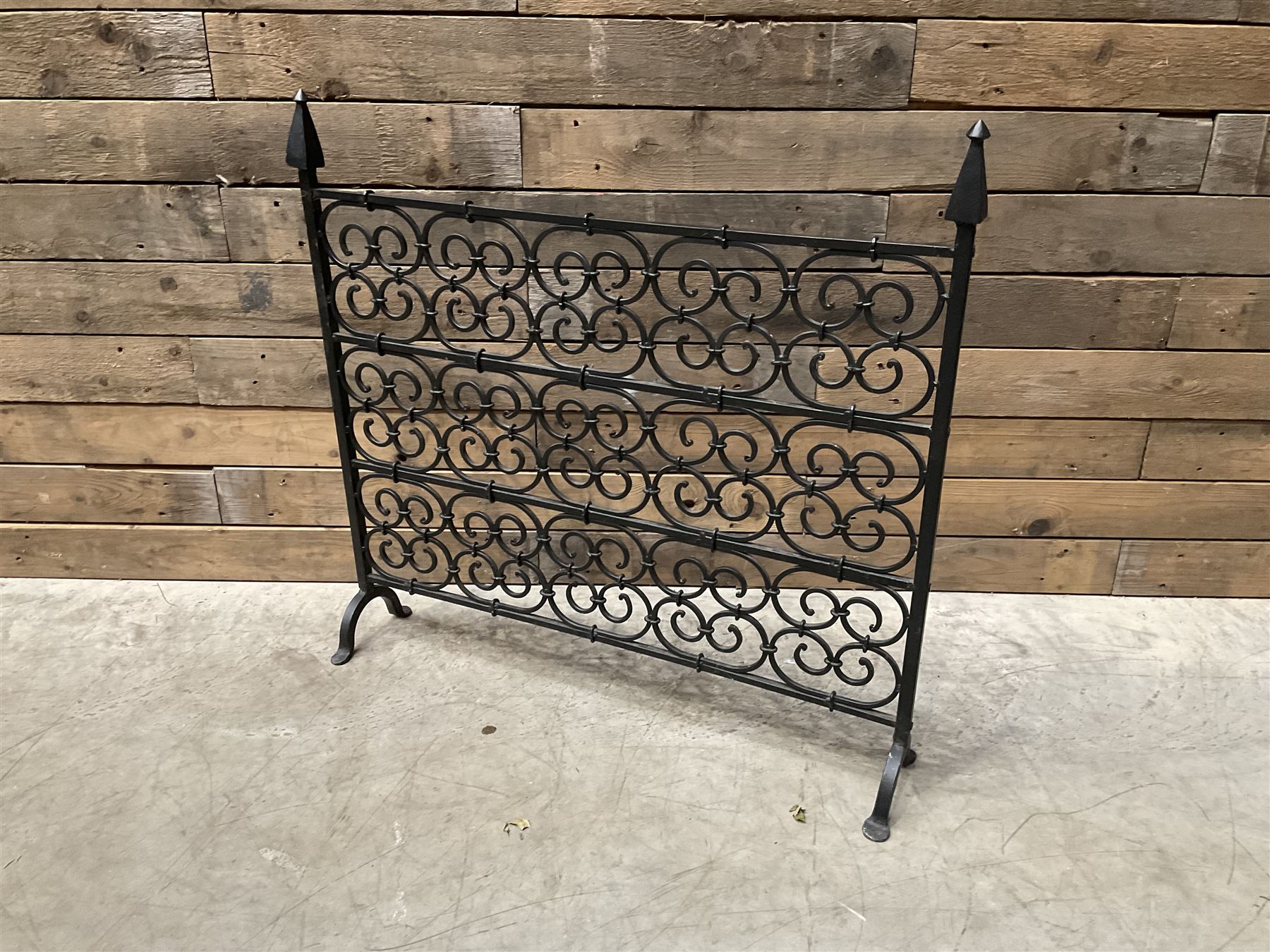 Black painted wrought iron fire guard , wicker log basket with stand, coal bucket and a fire kerb (4)