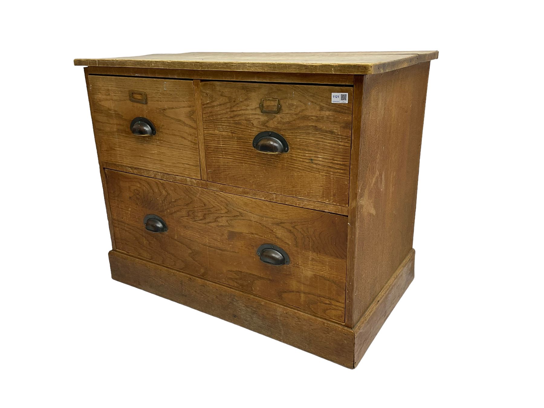 Early to mid-20th century oak chest, fitted with two short drawers over one long drawer, raised on plinth base