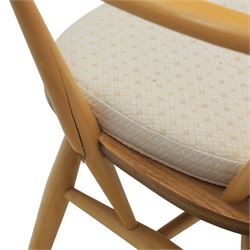 Ercol - elm dining chairs, set of six including two armchairs, arched spindle backs over shaped elm seats with upholstered pads, tapering beech legs joined by stretchers
