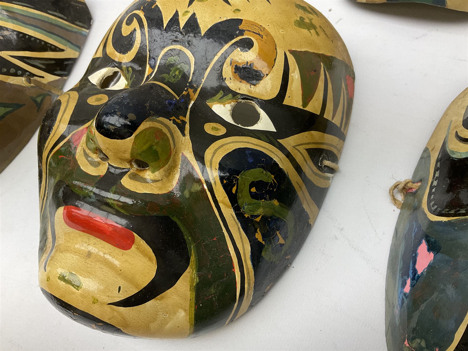 Five Japanese theatre / opera masks, the papier-mâché traditionally painted in the Noh Kabuki style, L18cm
