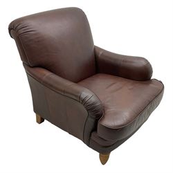 Howard design hardwood-framed armchair, rolled arms and back, upholstered in brown leather, on turned beech front feet 