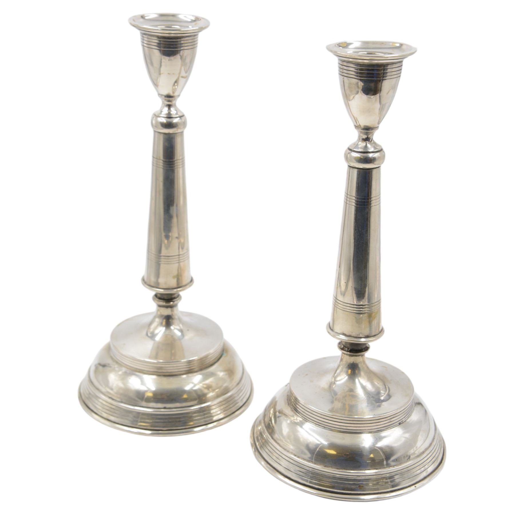 Pair of late 19th/early 20th century Austro-Hungarian 800 standard silver candlesticks, with tapering stems upon a domed base, stamped with Diana head with number 3 to the left, H33cm
