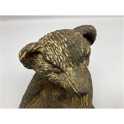 19th century cast iron door stop, modelled as a seated toy bear, with remnants of painted finish, H22.5cm