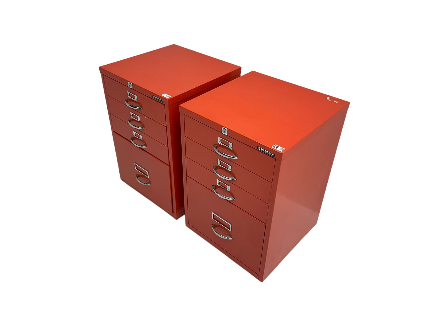 Two red finish 'Bisley' four drawer filing cabinet
