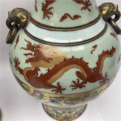 Pair of early 20th century Chinese vases decorated with dragons chasing a flaming pearl, with a gilt border of butterflies and floral sprigs, with Elephant head handles, H44cm 