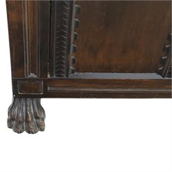 17th century design panelled oak blanket chest, hinged top above carved triple arch frieze, raised on individual carved claw feet