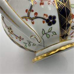 Early 20th century Royal Crown Derby teapot, decorated in a variant of the Imari pattern with blue and red prunus blossoms, with printed mark beneath including illustration date code for 1927, H14cm
