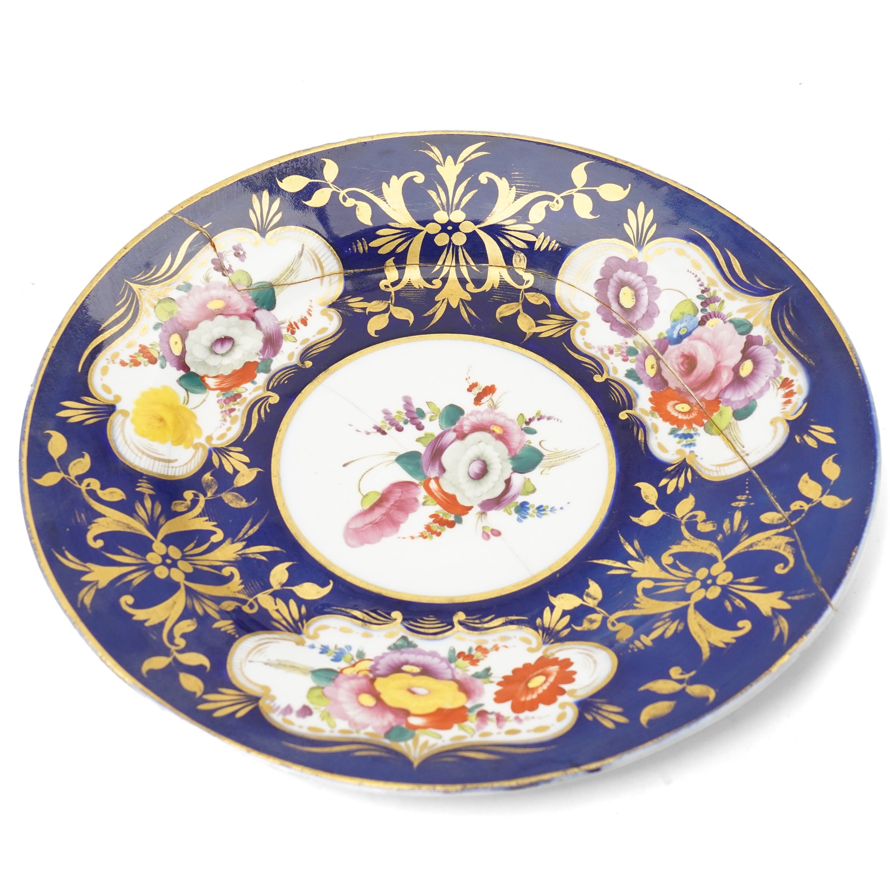 Collection of early 19th century Coalport pattern tea ware decorated with panels of flowers within a blue and gilt surround comprising eight tea cups, three coffee cups, eight saucers, four large plates, two handled sucrier and cover, milk jug and slop bowl and a similar small dish with loop handle