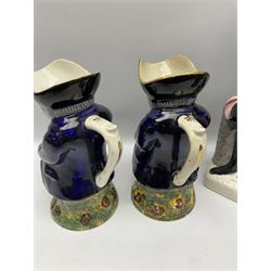 Mid 19th Century Staffordshire flatback figure of Louis Napoleon upon rectangular base, 41cm, and three further 19th Century Toby jugs modelled standing with their hands in waistcoat pockets, max H42cm