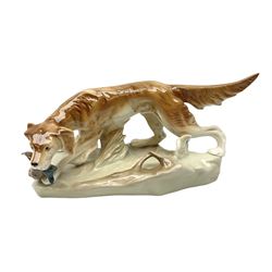 Royal Dux porcelain hunting dog with a bird, printed mark beneath, L36cm