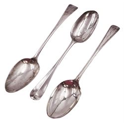 George II silver Hanoverian pattern table spoon, with rattail bowl and engraved with initials BV to terminal verso, hallmarked London 1730, makers mark IH or IK, possible Jeremiah King or John Hopkins, together with two George III silver Old English pattern table spoons, the first example with reed border, hallmarked Stephen Adams II, London 1787, the second example hallmarked London 1800, maker's mark indistinct