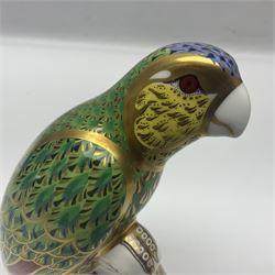 Two Royal Crown Derby paperweights, comprising Amazon Green Parrot, limited edition 1639/2500, with gold stopper and White Swan, with silver stopper, both with printed mark beneath and original box