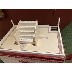 Seagull Pub - scratch-built wooden doll's house as a two-storey gable fronted public house painted in white green and maroon; the hinged front with ground floor veranda and window over opening to reveal two fully furnished rooms with dog-leg staircase and well stocked bar with bar-tender L31cm H62cm D37cm; together with Corner Shop and Dollies Pantry; a similarly painted scratch-built wooden two-storey flat-roofed doll's house as a well stocked ground floor grocery shop with stairs up to two further fully furnished rooms and more stairs giving access to a roof terrace L46cm H57cm D33cm (2)