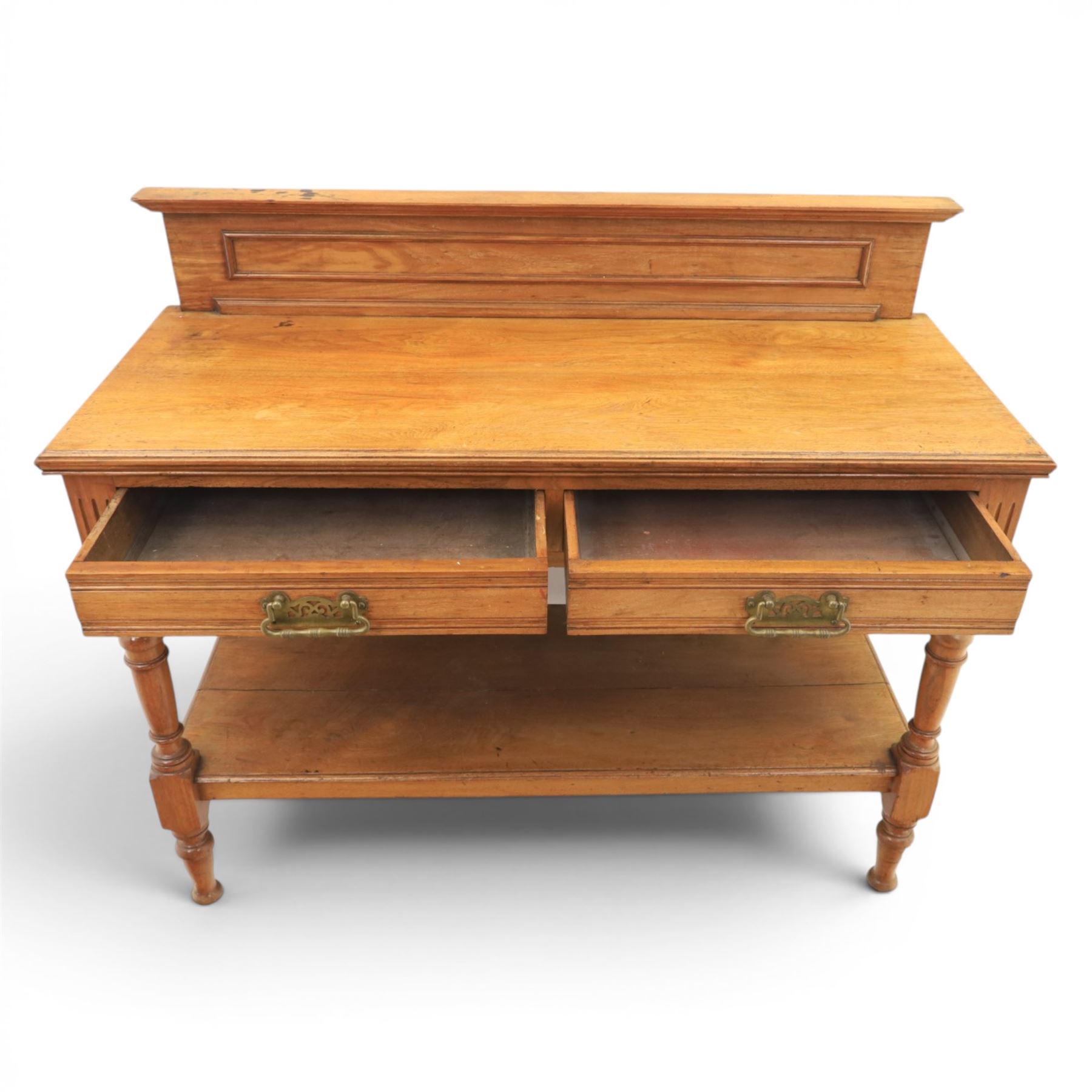 Edwardian oak serving table, raised panelled back over moulded rectangular top, fitted with two frieze drawers with brass drop handles, fluted front uprights, on turned supports united by potboard undertier