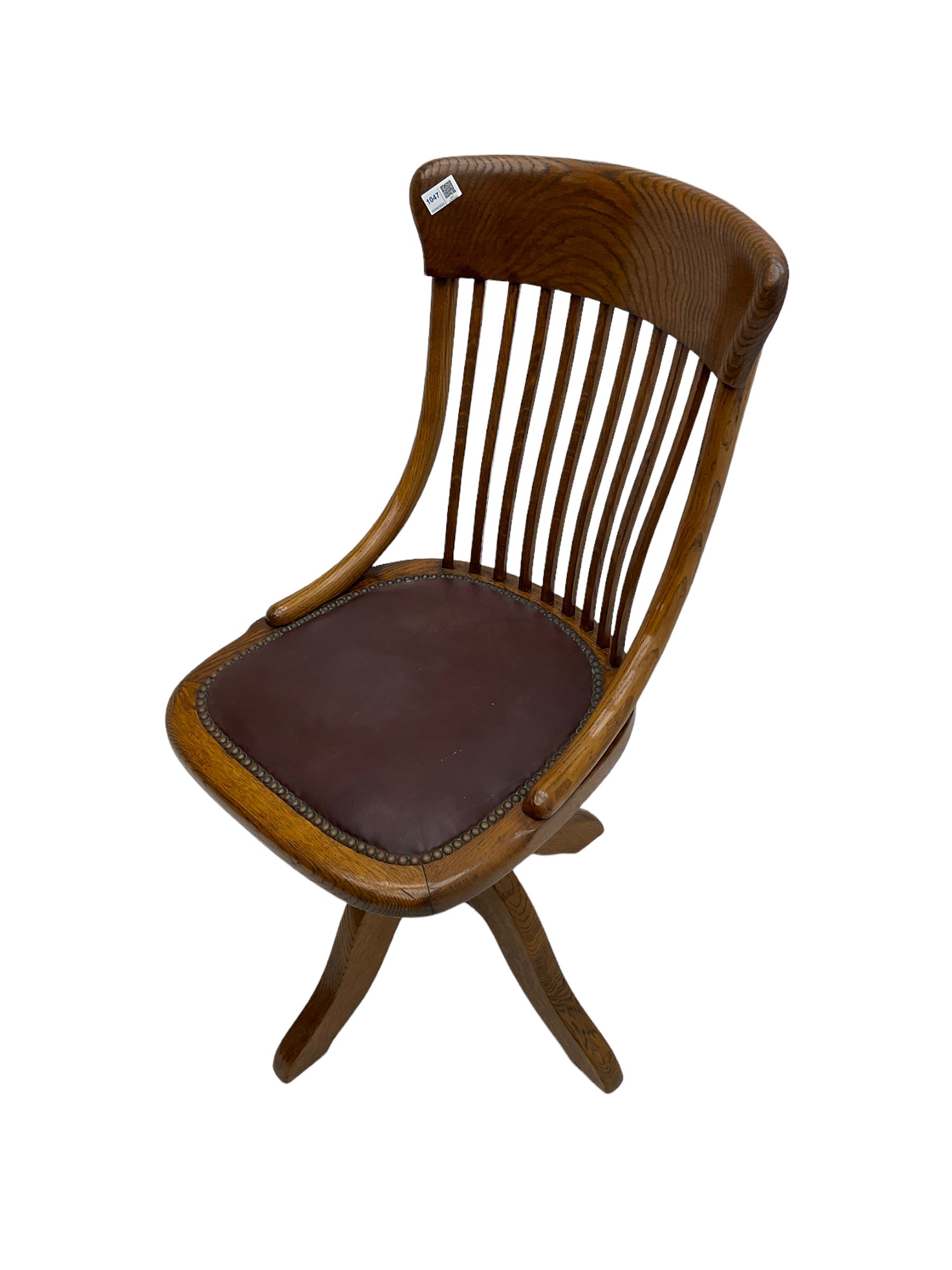 Early 20th century office oak adjustable swivel chair with studded leather seat
