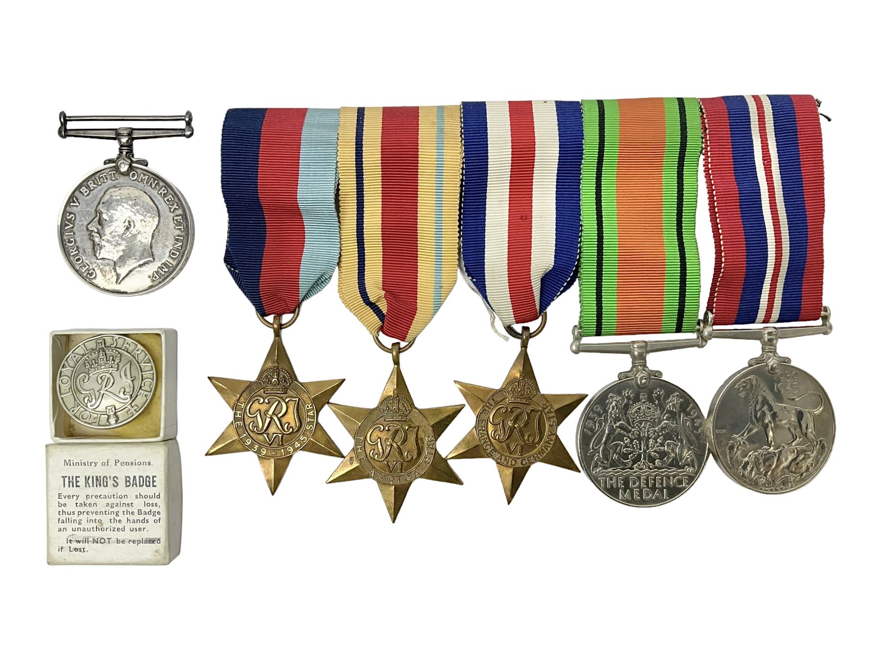 WWII group of five medals comprising 1939-45 War Medal, Defence Medal, 1939-45 Star, Africa Star and France and Germany Star on wearing bar; WWI British War Medal awarded to 142019 Pte. A. Thompson A.S.C.; and boxed King's Badge 'For Loyal Service'