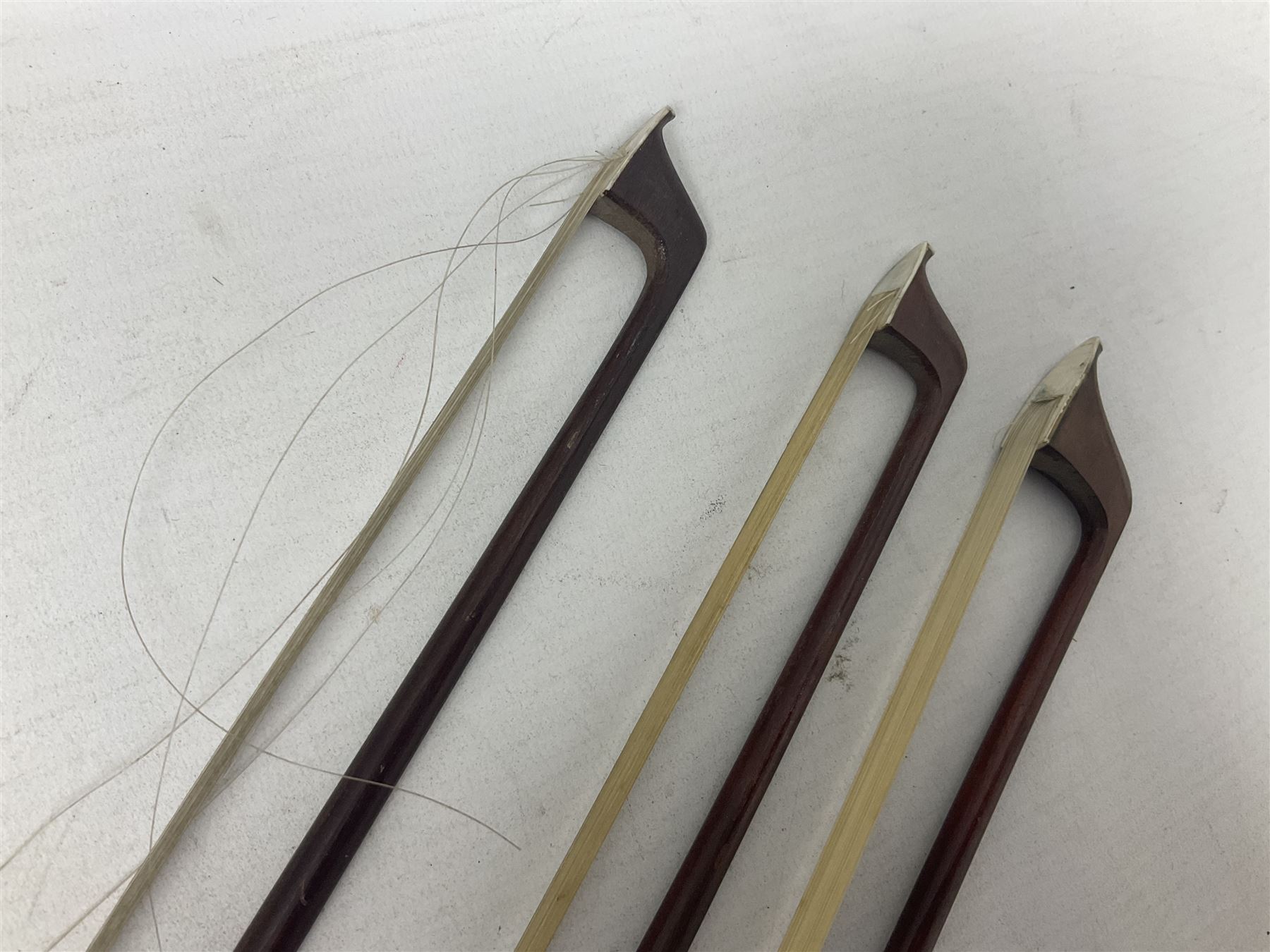 Incomplete amateur made violin c1880 for restoration and completion with 36.5cm one-piece maple back and ribs and spruce top L59.5cm; together with two brazilwood violin bows and pernambuco cello bow, all with nickel mounts (4)