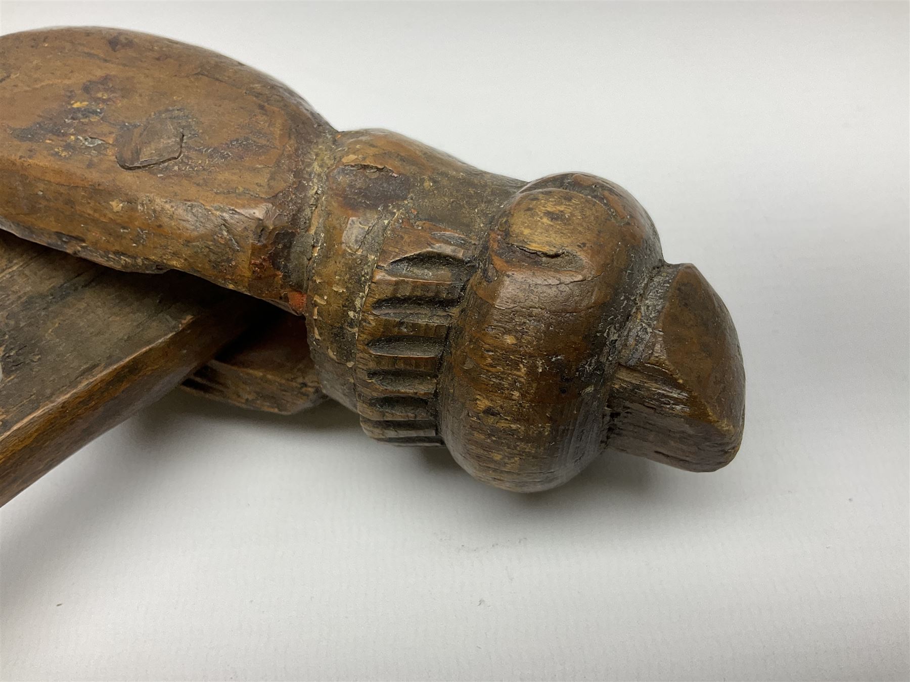 Rare primitive treen lever action nutcracker, probably late 17th/early 18th century, carved in the form of a man, with old collector label to side inscribed 'A Nutcracker XVI Century', H18cm
