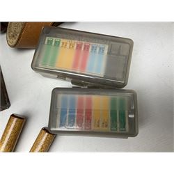 Assorted militaria including ten leather or canvas cartridge and other belts, maroon beret with 17th Lancers cap badge, modern bullet mould, leather and brass shot flask, two knives, shell cases, boomerang etc; in tin deed box