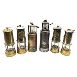 Six miners lamps - Oldham Type 'F' steel and white metal H30cm; Oldham all brass No.900-4090; two Protector Lamp & Lighting Company Limited brass and steel; British Coal Mining Company Wales U.K. brass and steel; and another unmarked all brass (6)