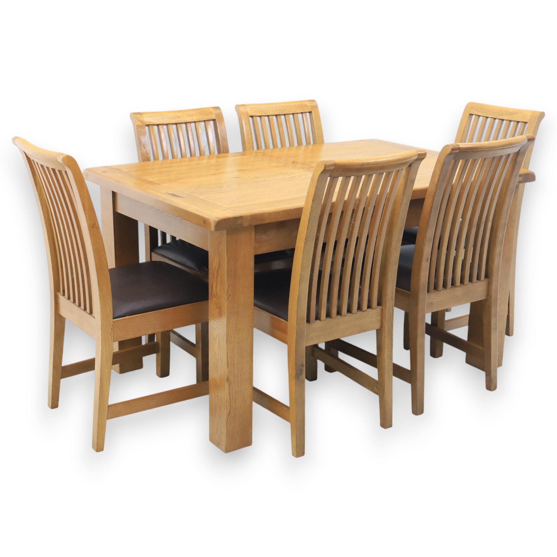 Contemporary oak extending dining table, moulded rectangular top with visible grain and inset extension leaf, pull out extending mechanism, standing on four square legs, accompanied by a set of high slat back chairs with upholstered brown faux leather seats and square tapering supports joined by stretchers