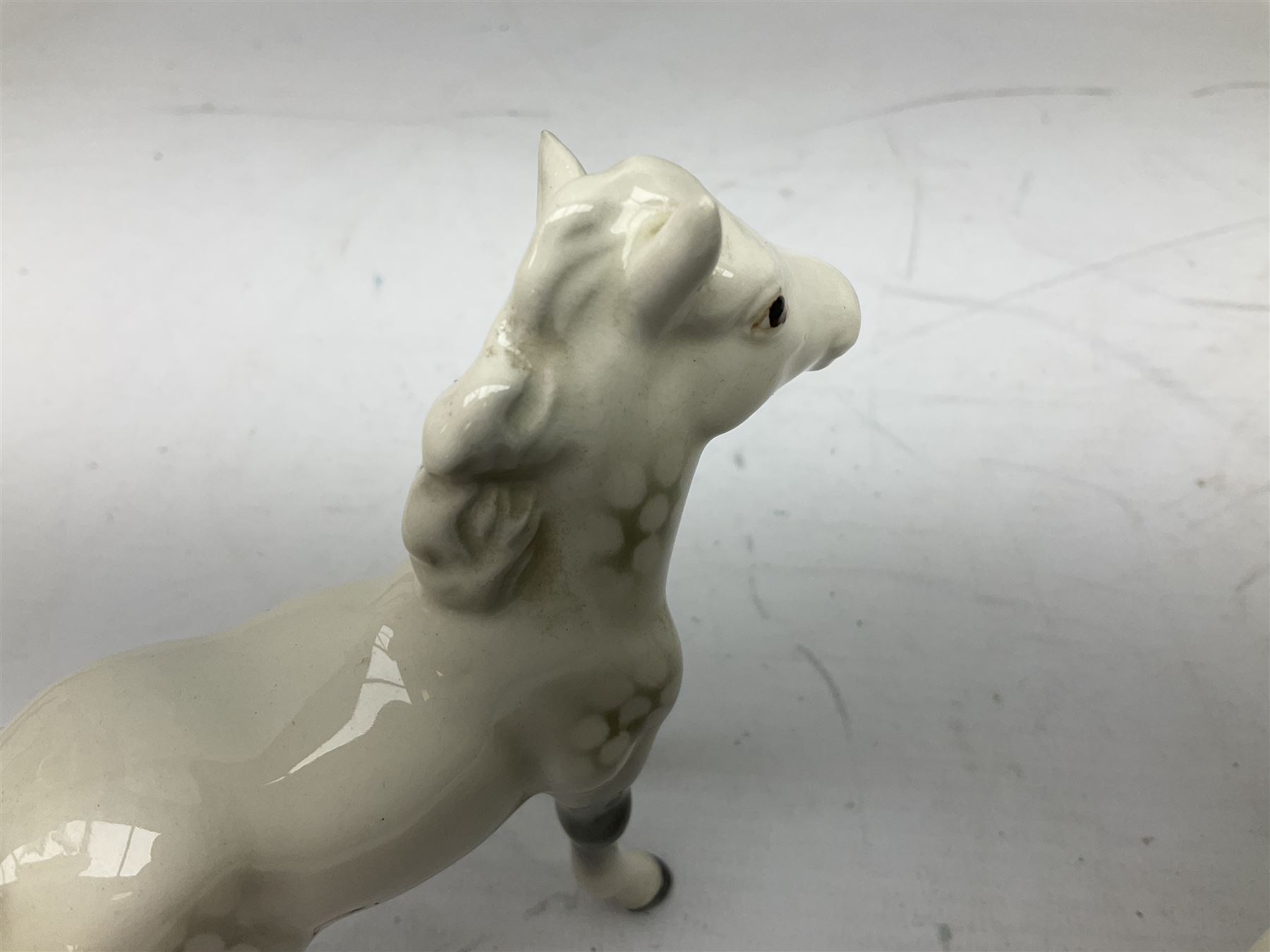 Seven Beswick figures of horses, including Connemara pony in grey no.1641, Arab in bay no.1265, large foal in grey no.947 etc, together with a Goebel figure of a horse (8)