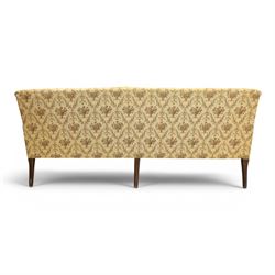 George II mahogany framed settee, beige foliate upholstery with padded sides, downswept arms with sprung seat and back, raised on six turned supports