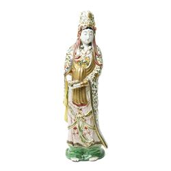 Japanese Satsuma figure of Kannon (Guanyin), Meiji period, standing holding a scroll in or...