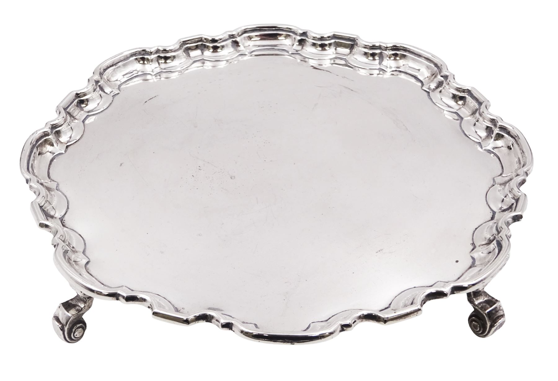 1930s silver waiter, of hexagonal form with pie crust rim, upon four scroll feet, hallmarked Manoah Rhodes & Sons Ltd, Sheffield 1936