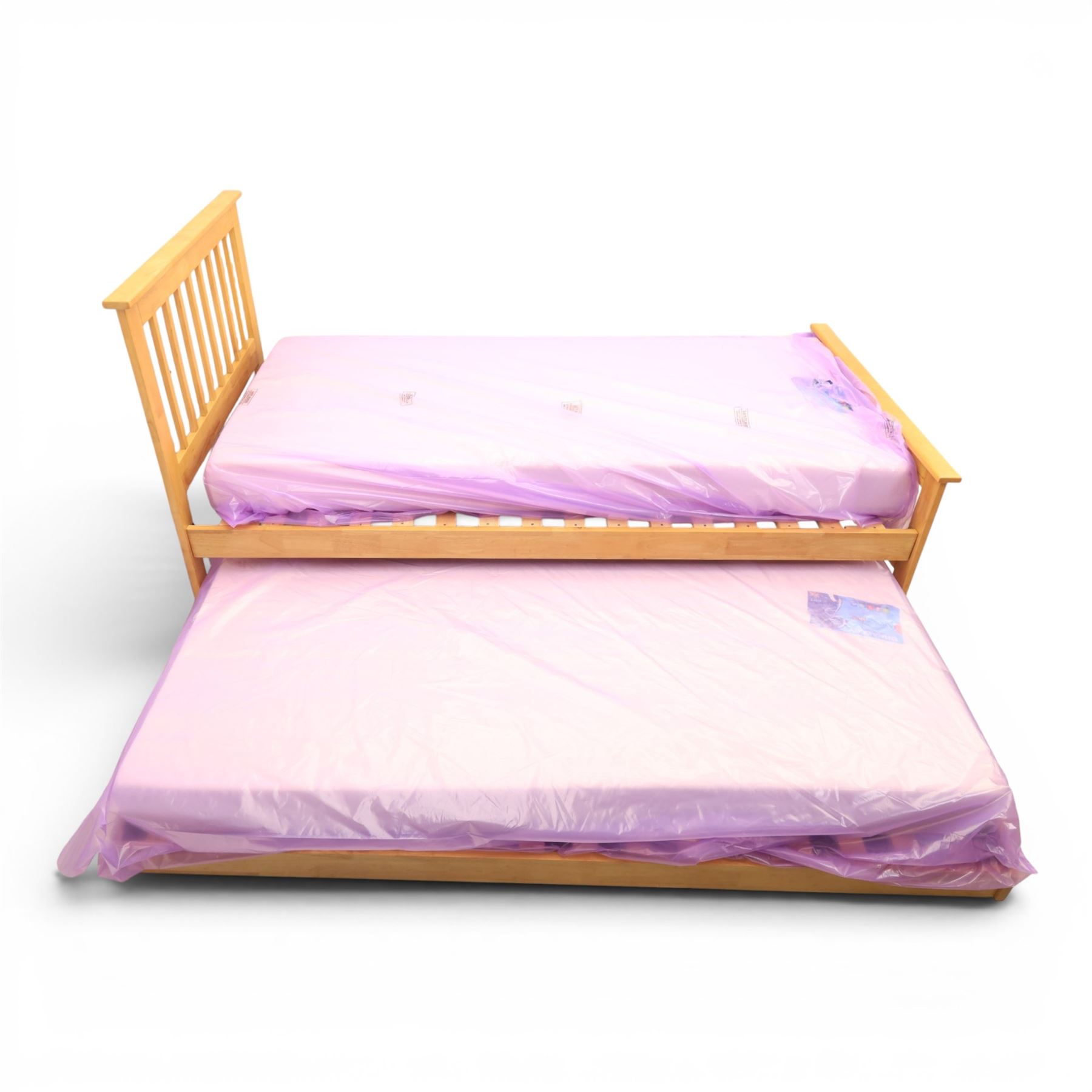 Contemporary light oak trundle bed, slatted headboard and footboard,  incorporating pull-out trundle bed on castors, complete with two memory foam mattresses