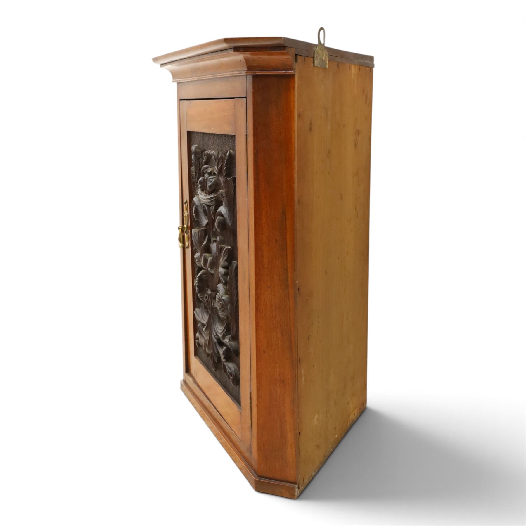 Edwardian walnut hanging corner cabinet, single panelled door with applied carved foliate decoration enclosing shelf 