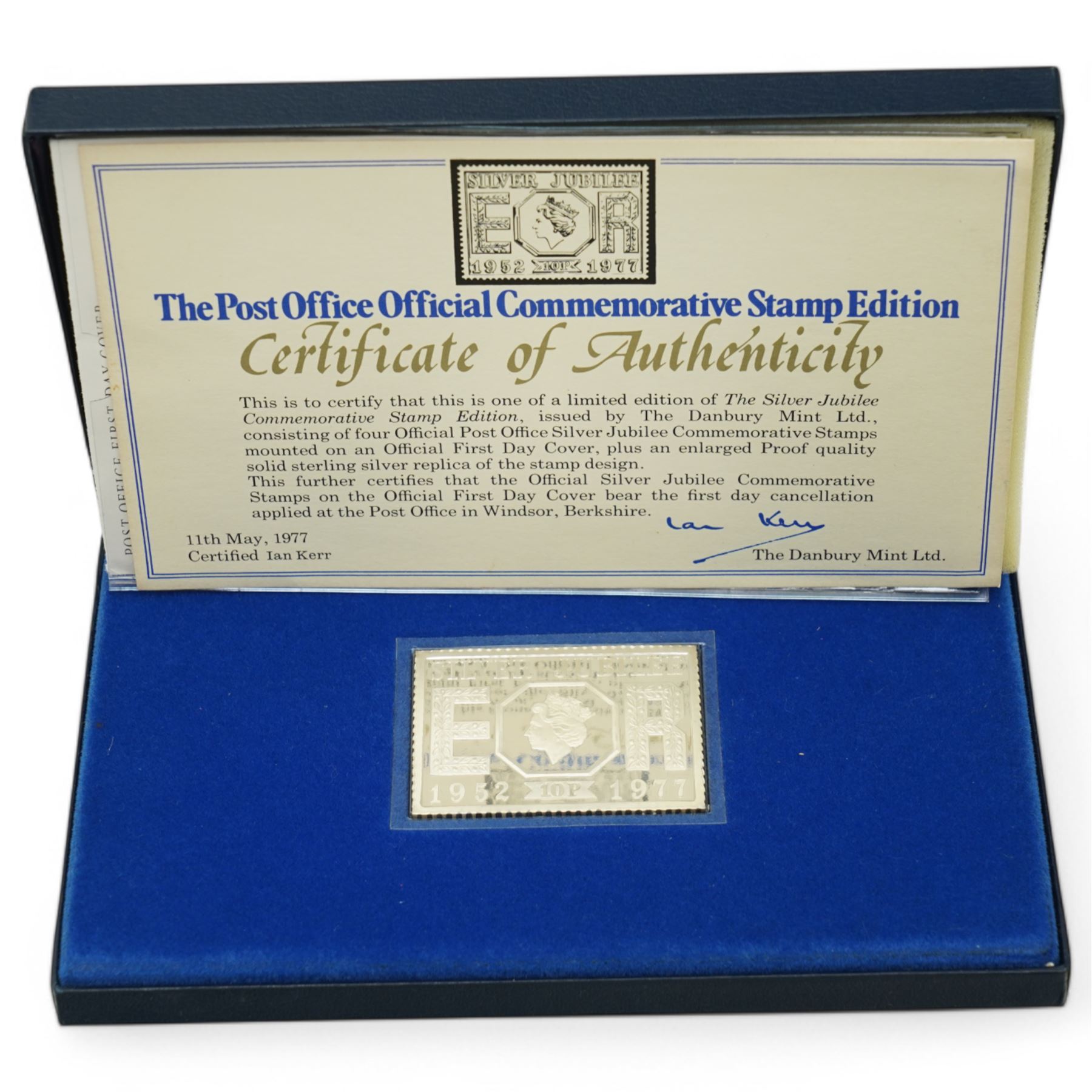 Queen Elizabeth II 'Silver Jubilee' hallmarked sterling silver commemorative stamp ingot, Channel Islands 2002 'The Duke of Wellington' silver three coin set, 2006 'The Queen's Eightieth Birthday Silver Lenticular Medal', Isle of Man 2021 'Silver Proof Sovereign', Danbury Mint 'The 2023 Early Issue Silver Britannia Change-of-Portrait Set', all cased with certificates and a facsimile newspaper etc