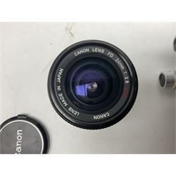 Collection of Canon lenses, to include 'Canon Lens FD 100mm 1:2.8', serial no 12821, 'Canon Lens FD 200mm 1:4' serial no 245313, 'Macro Canon Lens FL 50mm 1:3.5', serial no. 25505, 'Canon Lens FD 135mm 1:3.5 etc, together with other Canon equipment, including Bellows FL, Slide Duplicator etc 