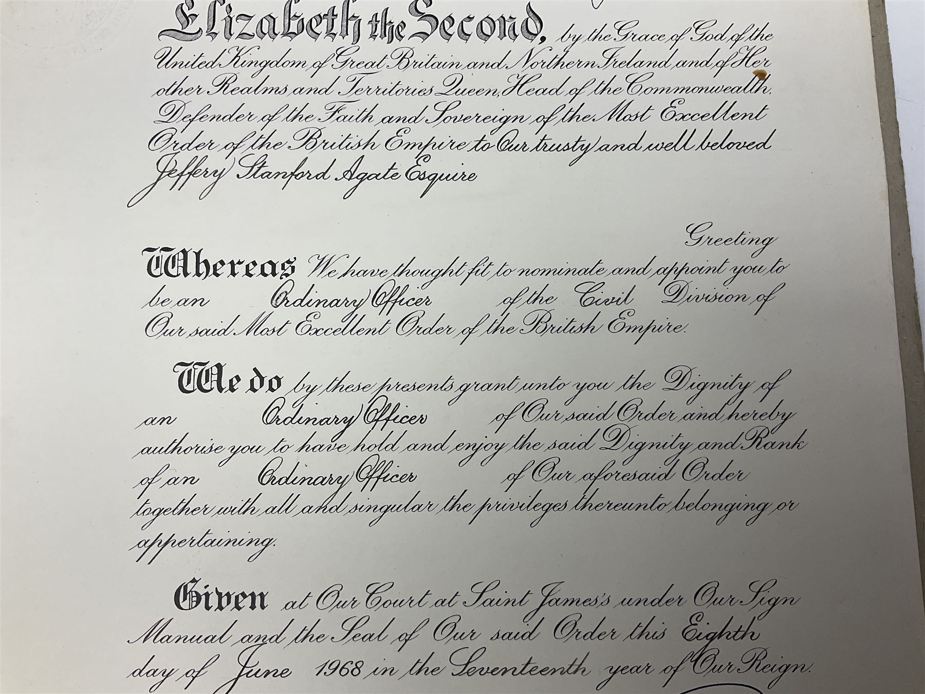 George VI Knight of the Garter cloth beret insignia with pin back and photograph of the Knight's Robes; Edmund Fellowes book on The Knights of the Garter 1348-1939; together with EIIR civilian OBE certificate to Jeffery Stanford Agate with facsimile signatures of Elizabeth II and Prince Philip