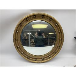 20th century convex circular gilt wall mirror, with a later eagle surmount together with art deco frameless faceted mirror and another convex circular mirror
