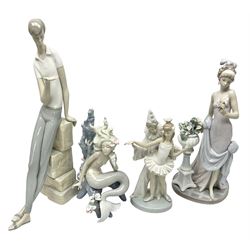 Four Lladro figures, comprising Touch of Class no 5377, Boy Student no 4517, Ocean Beauty no 5785 and Carnival Couple no 4882, largest example H45cm