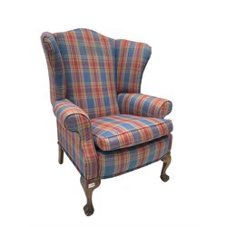 Georgian design wingback armchair, upholstered in tartan fabric, raised on cabriole supports with ball and claw feet