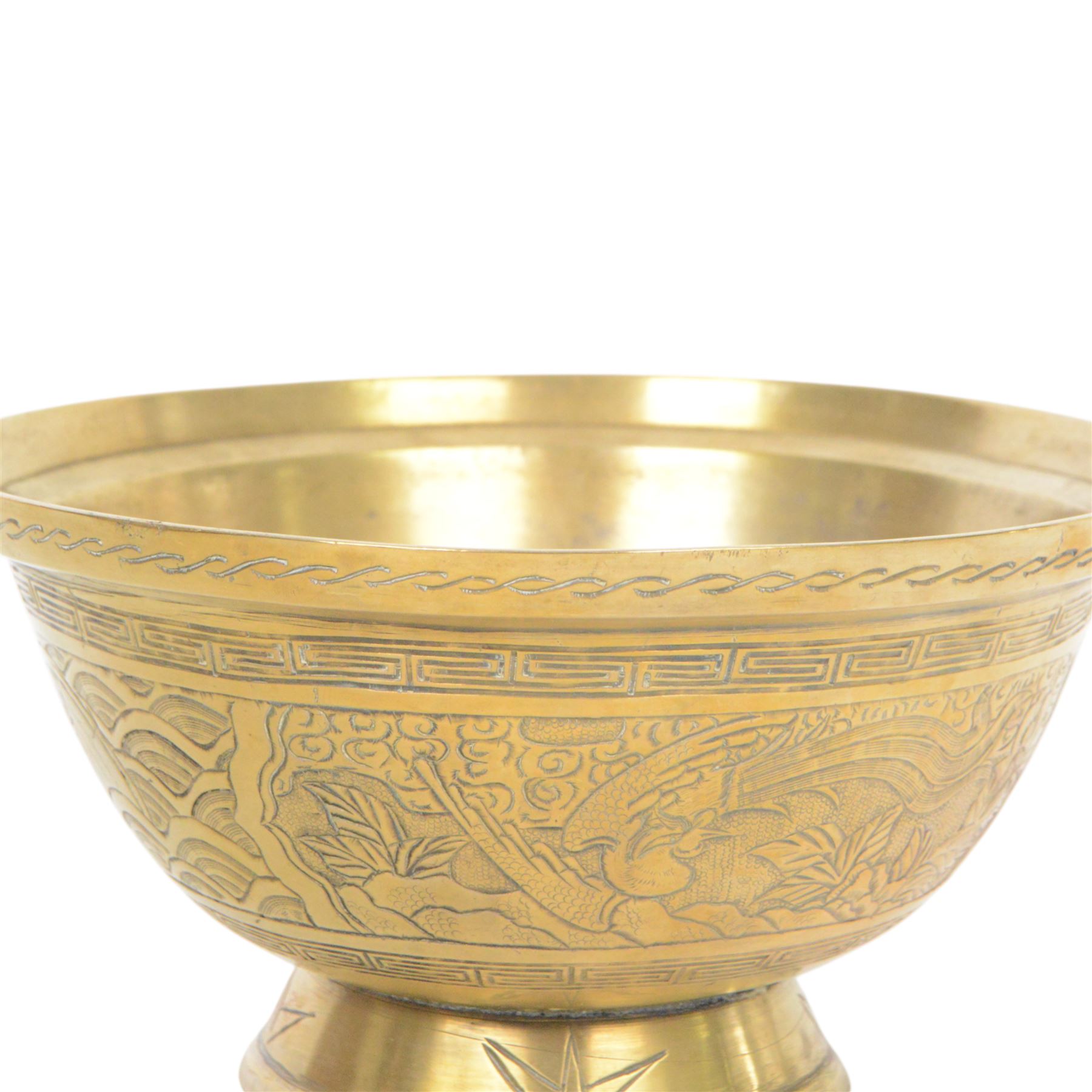 Chinese brass bowl, decorated to the outside with dragons,  upon a circular base, cast seal mark to base, D26cm