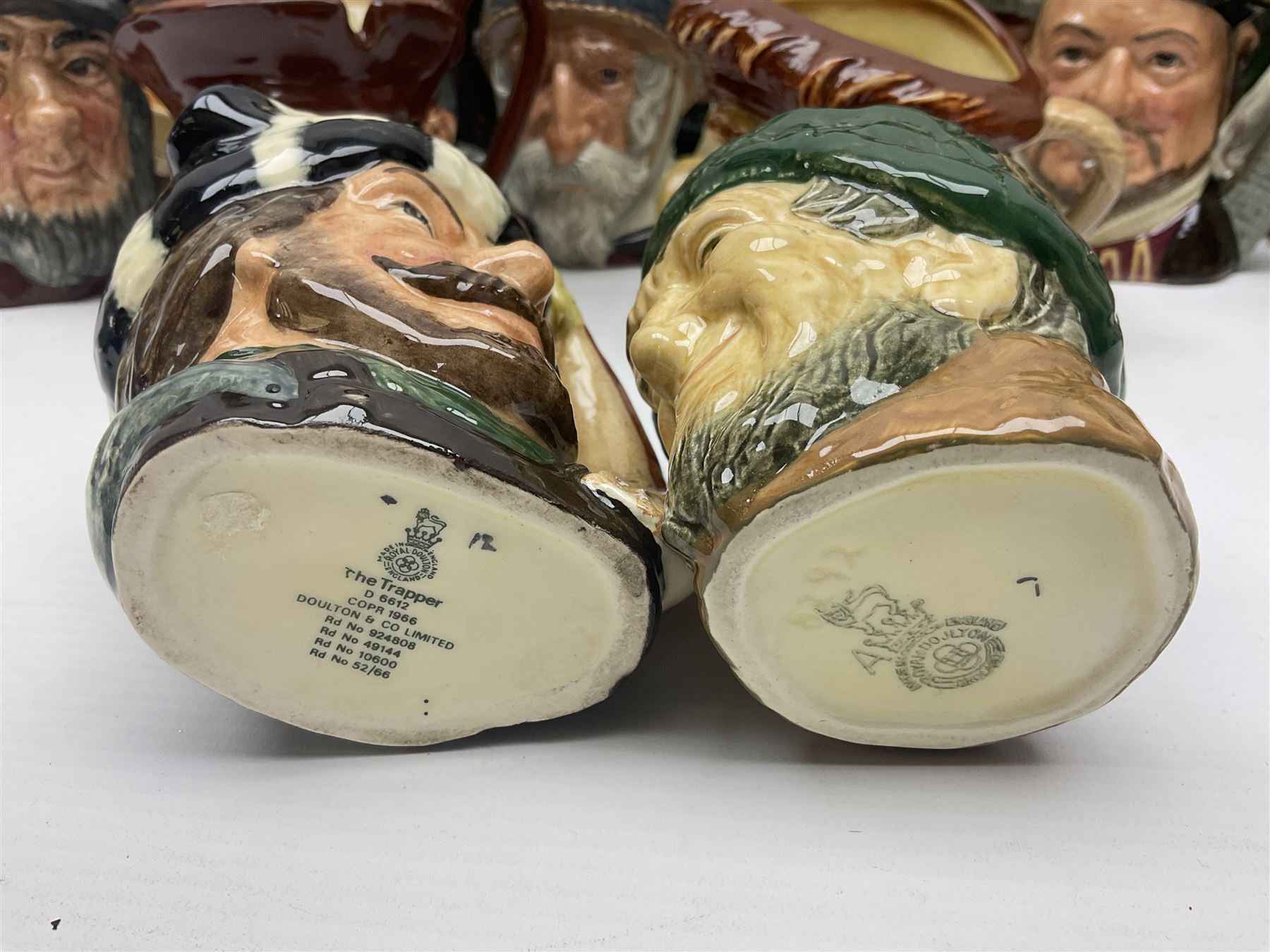 Large collection of Royal Doulton character jugs, to include Robinson Crusoe D6532, Tam O Shanter D6632, The Falconer D6533 etc, together with similar charater jugs and toby jugs   