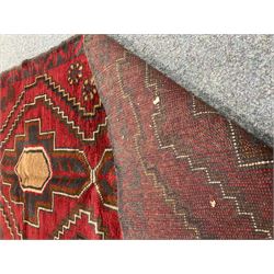 Baluchi red and blue ground rug, repeating border