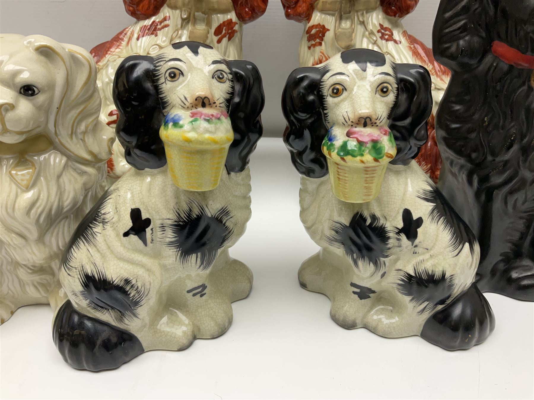 Two Pairs of Staffordshire style dogs, together with three other examples, largest example H27cm