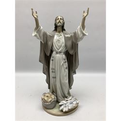 Lladro figure, The Loaves and Fishes, modelled as Jesus Christ with arms raised standing beside a basket of loaves and a basket of fish, sculpted by Salvador Furió, with original box, no 5896, year issued 1992, year retired 1997, H35cm