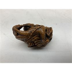 Hardwood bust of an Indoniesian Goddess, carved wearing a pierced headdress, from Klungkung, Bali, H20cm, together with a pair of bone carvings of deity figures, and a carved wood Netsuke in the form of a Chinese dragon