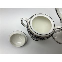 Wedgwood navy Florentine pattern coffee service for six, comprising coffeepot, coffee cans and saucers, milk jug, twin handled covered sucrier and small dish