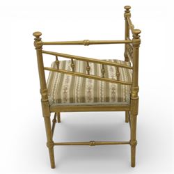 19th century Scandinavian corner chair, with rail back and sides formed with turned spindles and finial terminals, fitted with an upholstered seat in striped floral fabric, raised on turned supports united by stretchers