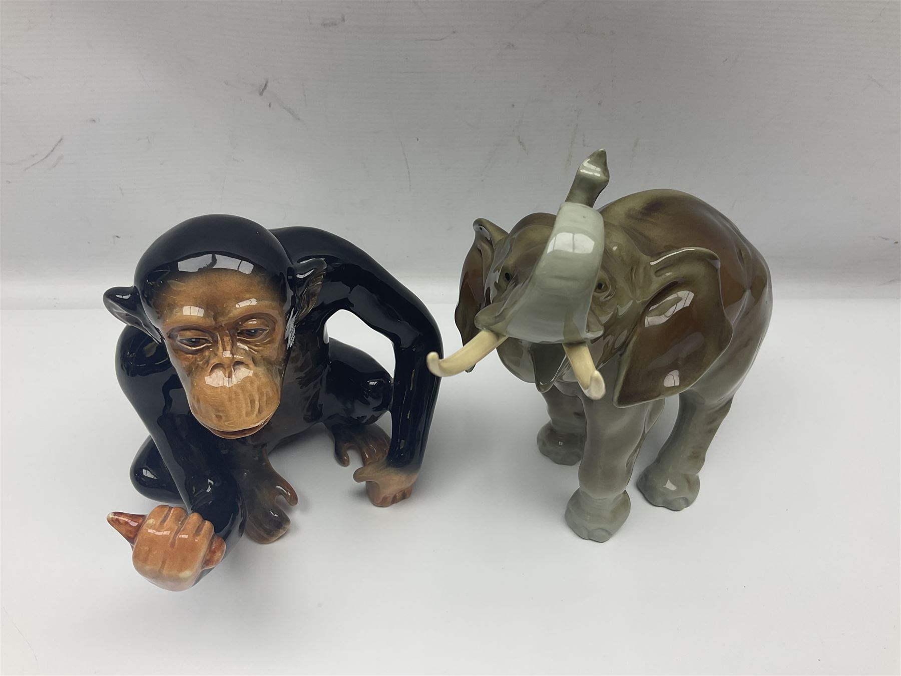 Large Sylvac monkey together with three smaller monkeys, together with Beswick Pigeon no 1383, Melba Ware hippo and baby and Royal Dux elephant 